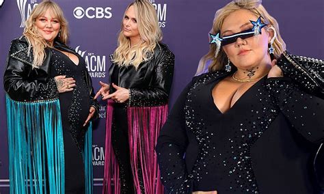 Pregnant Elle King debuts her baby bump in a sparkly black jumpsuit at the ACMs