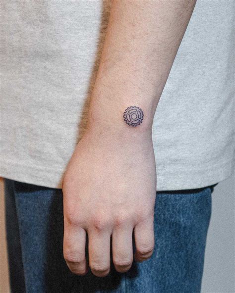 Small chainring tattoo by tattooist Bongkee - Tattoogrid.net