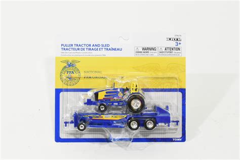 1/64 National FFA Blue & Yellow Pulling Tractor With Yellow Cage & Pulling Sled - Daltons Farm Toys