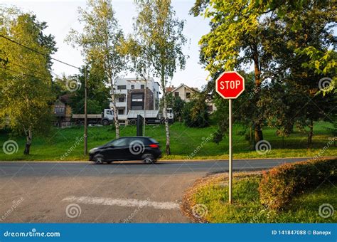 Stop sign and a car stock photo. Image of information - 141847088