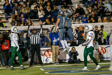 Wide receiver Romeo Doubs of the Nevada Wolf Pack celebrates getting ...