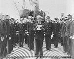 [Photo] Commander Joseph Willingham reading his orders to assume command of submarine USS Bowfin ...