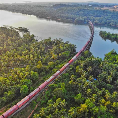 Aerial shot of Sharavati river at its fullest glory, with a goods train ...