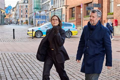 Crown Prince Frederik pictured holding hands with Princess Mary as they reunite with their ...