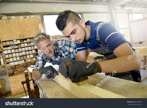 Carpenter With Apprentice In Training Period Stock Photo 480732061 : Shutterstock