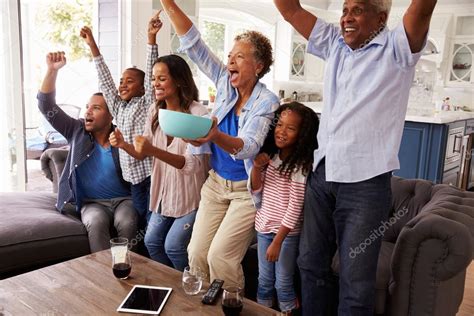 Family watching sport on TV — Stock Photo © monkeybusiness #109943300