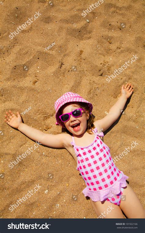 Little Girl Lying On Sandy Beach Stock Photo 101922166 | Shutterstock