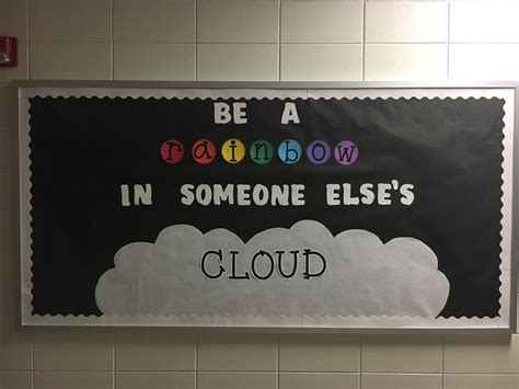 a bulletin board that says be a rainbow in someone else's cloud