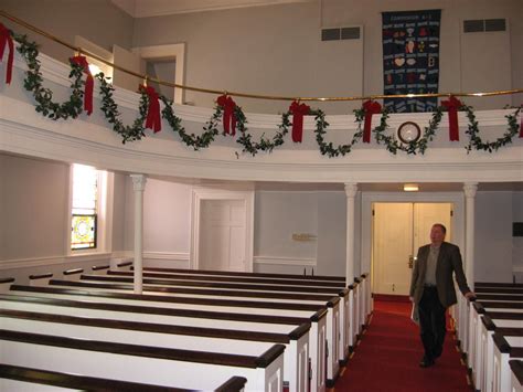 Pastor Scott DeBlock checks out the Christmas decorations recently put up in the sanctu ...