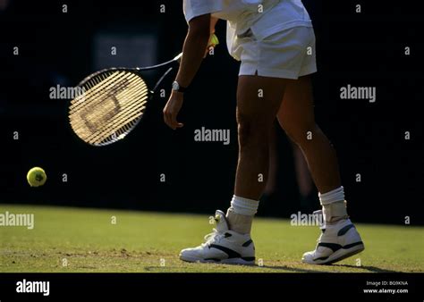 Tennis player on a grass court Stock Photo - Alamy