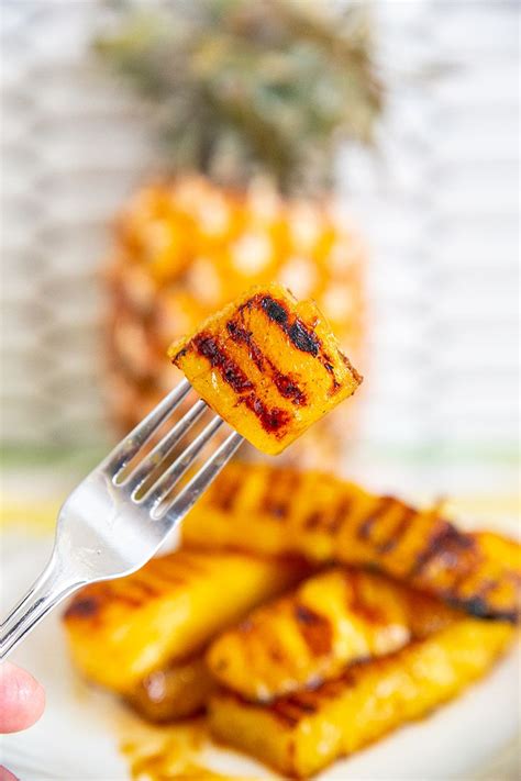 The best grilled pineapple recipe! Pineapple spears are marinated in a maple butter cinnamon ...