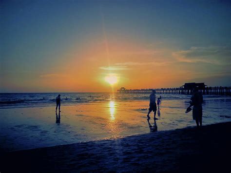 Naples beach at sunset Photograph by Susan Jacob | Fine Art America