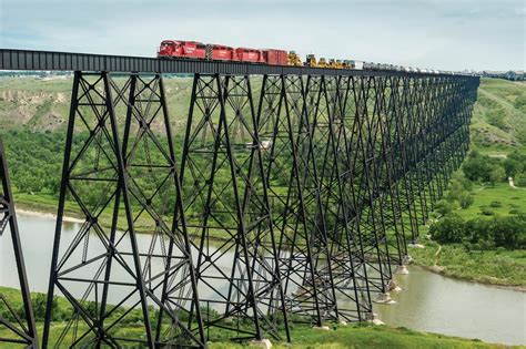 Freight train crossing trestle in Lethbridge, Canada [original photo by CP Rail] : pics