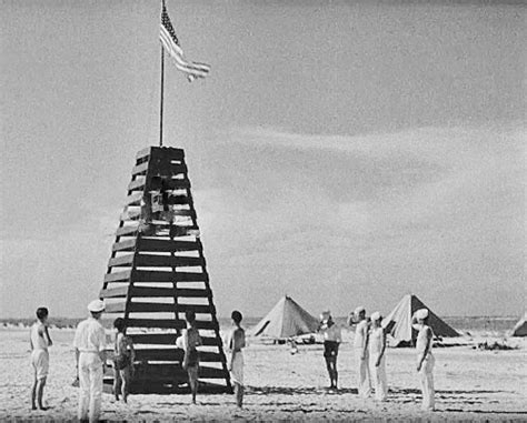 Raising the American flag on Jarvis Island. This was taken immediately after assembling ...