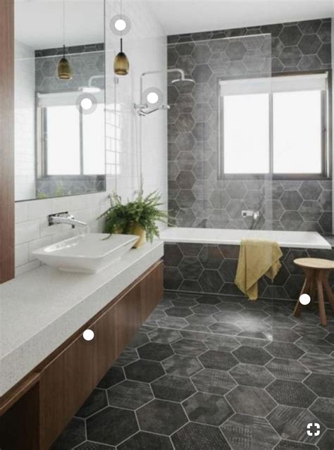 I like how the floor tile goes up the tube and also up the wall. Looks very linear. I like the ...