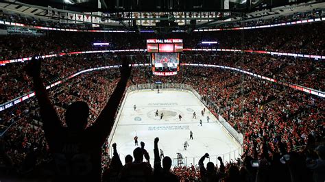 a hockey game is being played in an arena