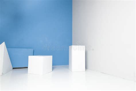 White Geometric Shapes in Room with Blue Wall Stock Photo - Image of empty, urban: 172671014