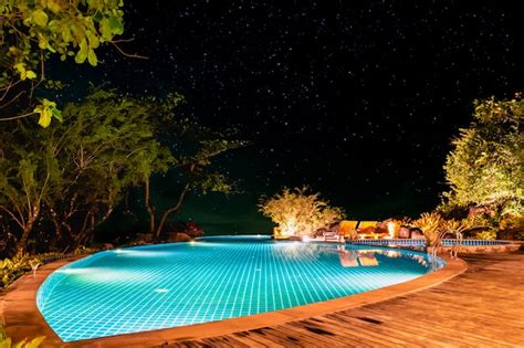 Premium Photo | The swimming pool in the night under a starry sky