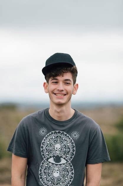 Premium Photo | Portrait of smiling young man outdoors