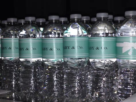 several bottled water bottles lined up on a shelf