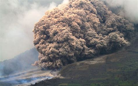 Volcano Mount Sinabung in Sumatra, Indonesia erupts spewing lava and ash