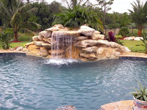 Natural Rock Accents & Waterfalls - CHAMPION POOLS