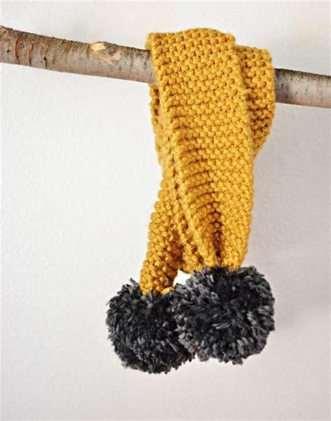 Knitted Pom Pom Scarf | AllFreeHolidayCrafts.com