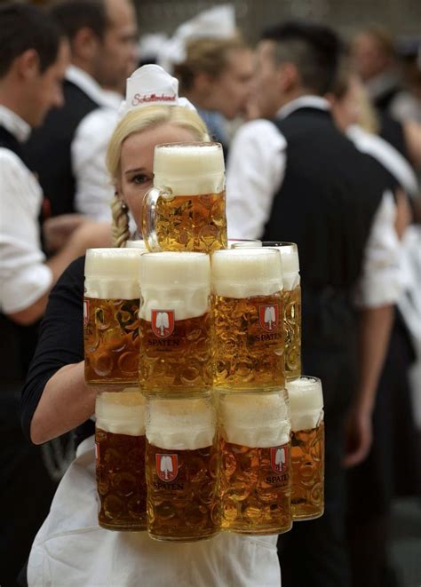 How do they the waiters at Oktoberfest beer tents do it?! This memorable image captures one of ...