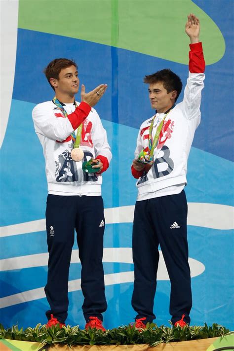 Where's Daniel Goodfellow? Tom Daley's diving partner is cut out of pictures after their bronze win