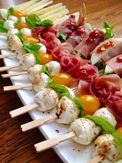 Ciliegine mozzarella basil and yellow pear tomato skewers. Prosciutto wrapped arugula and pear ...