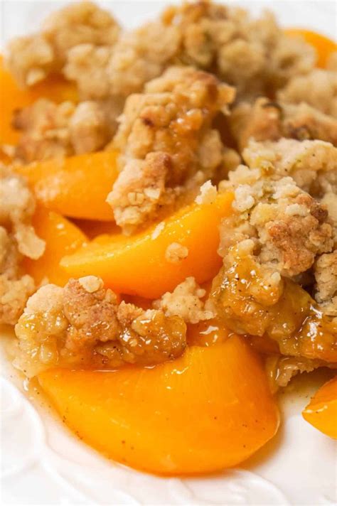 Peach Crumble is a delicious dessert recipe made with canned peaches and topped with a crunchy ...