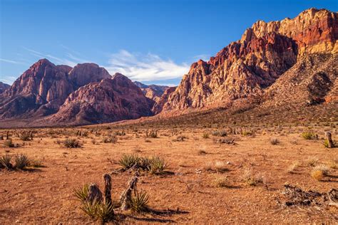 The rugged arid landscape of Nevadas Red Rock Canyon stretches into the distance. See more # ...