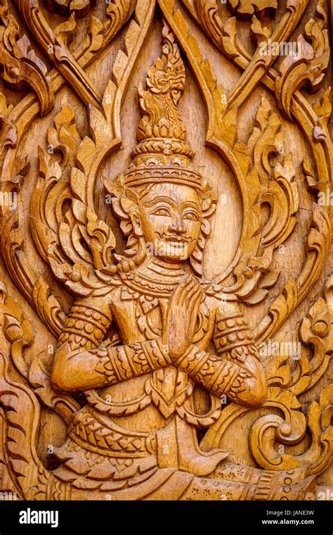 Traditional Thai Art in wood carving for decoration on Buddhist temple doors or windows Stock ...