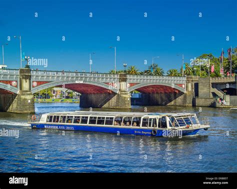 River cruise boat on Yarra River with Princes Bridge behind, Southbank ...