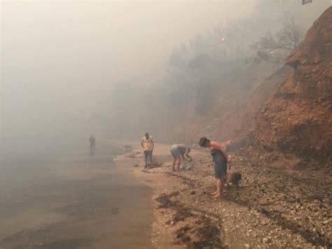 Heartbreaking Photos Emerge as Residents Try to Escape Greek Fire