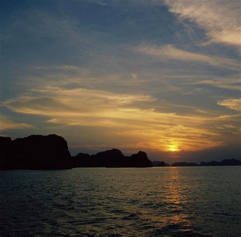 Halong Bay Sunset Photograph by Tbelarbi - Fine Art America