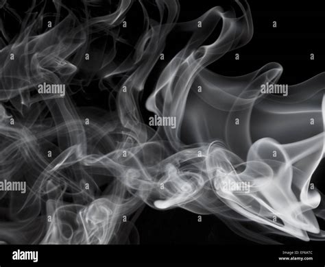 Grey smoke on black background Stock Photo - Alamy