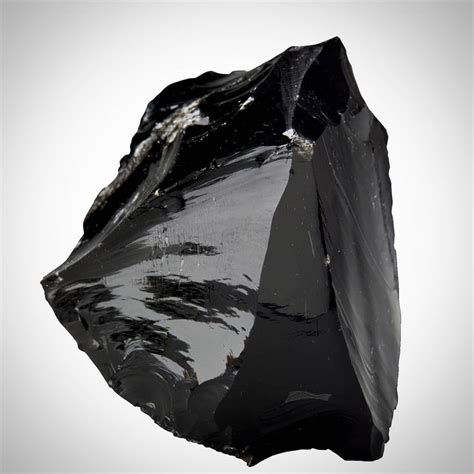 It is obsidian rock which is a extrusive igneous rock and it shows ...