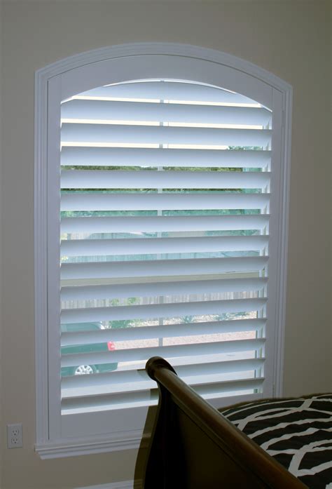 A real wood arched shutters is the only proper way to cover the eyebrow ...