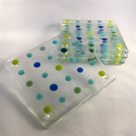 two glass plates with different colored dots on them