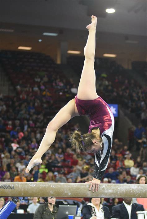 University of Denver gymnast Alix Angelopulo holds a back walkover on ...