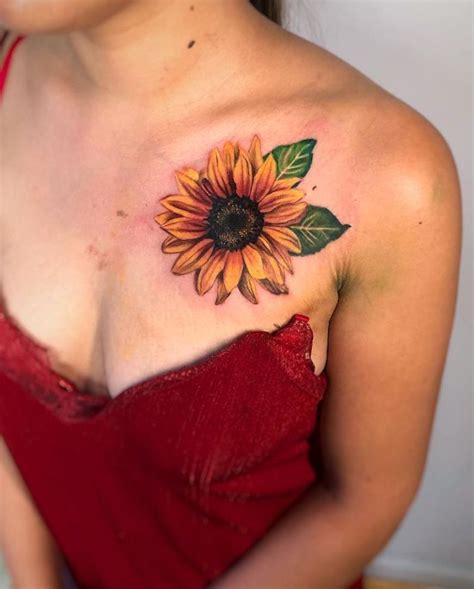 a woman with a sunflower tattoo on her chest