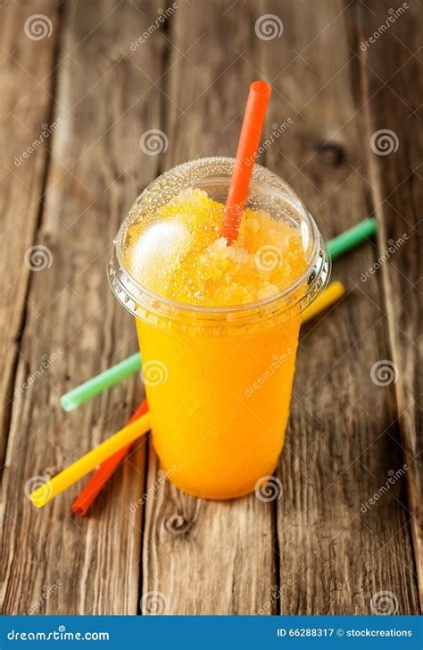 Frozen Orange Slushie in Plastic Cup with Straw Stock Image - Image of cooled, iced: 66288317