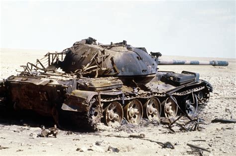 An Iraqi T-55 main battle tank lies in ruins after being destroyed by the French 6th Light ...