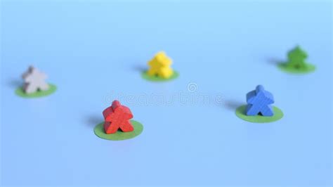 Several Multicolored Small Wooden Figures of People Stand at a Distance from Each Other Stock ...