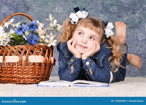 Little Girl Reading Book while Lying on Floor Stock Image - Image of ...