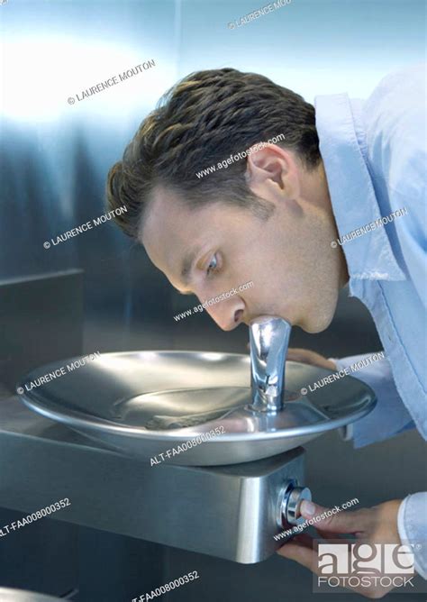 Man drinking from water fountain, Stock Photo, Picture And Royalty Free ...