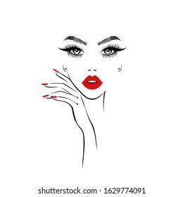 a woman's face with red lipstick and nails