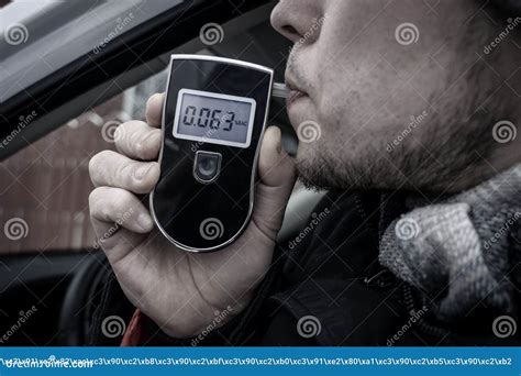 A Man with a Breathalyzer in the Car Stock Image - Image of driver, closeup: 214228333