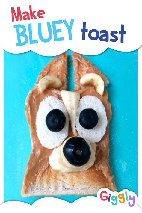 a toast with peanut butter and blueberries on it that looks like a dog's face